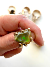 Large natural opal claw set ring